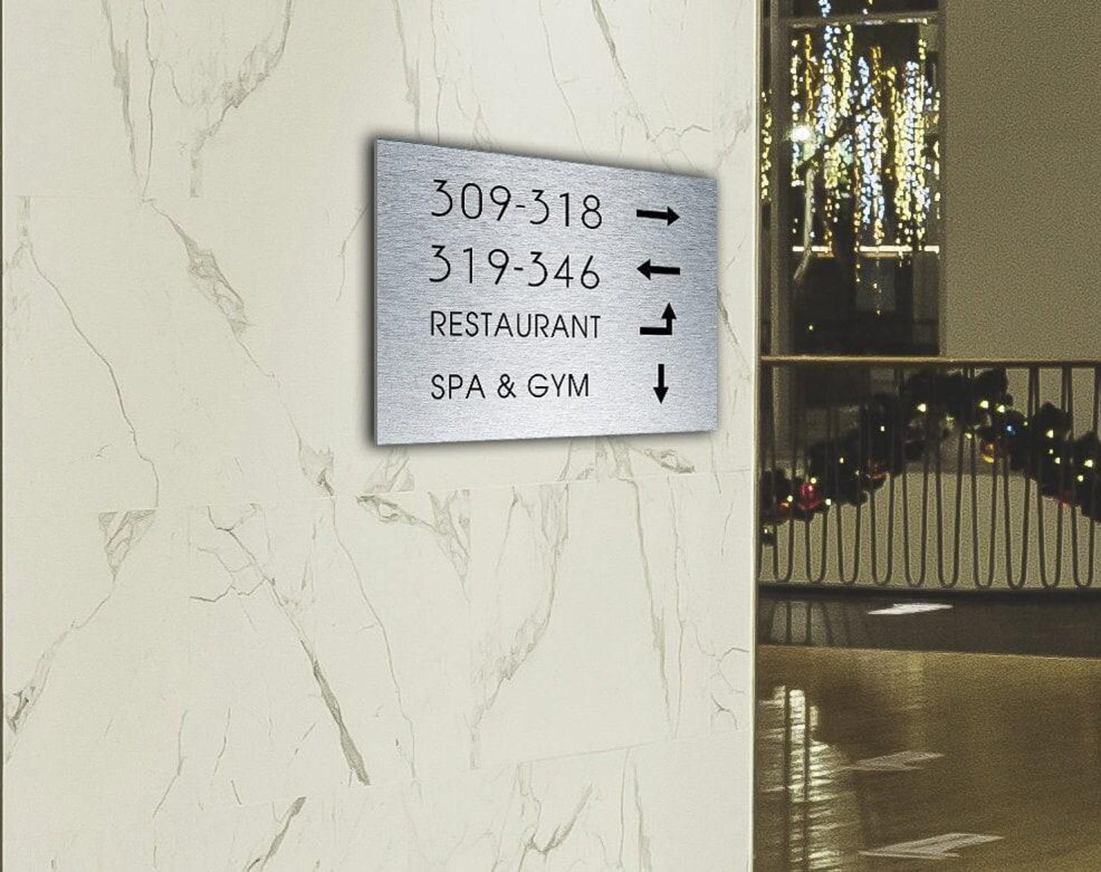 Hotel panel in brushed aluminum with backlit channel letters.