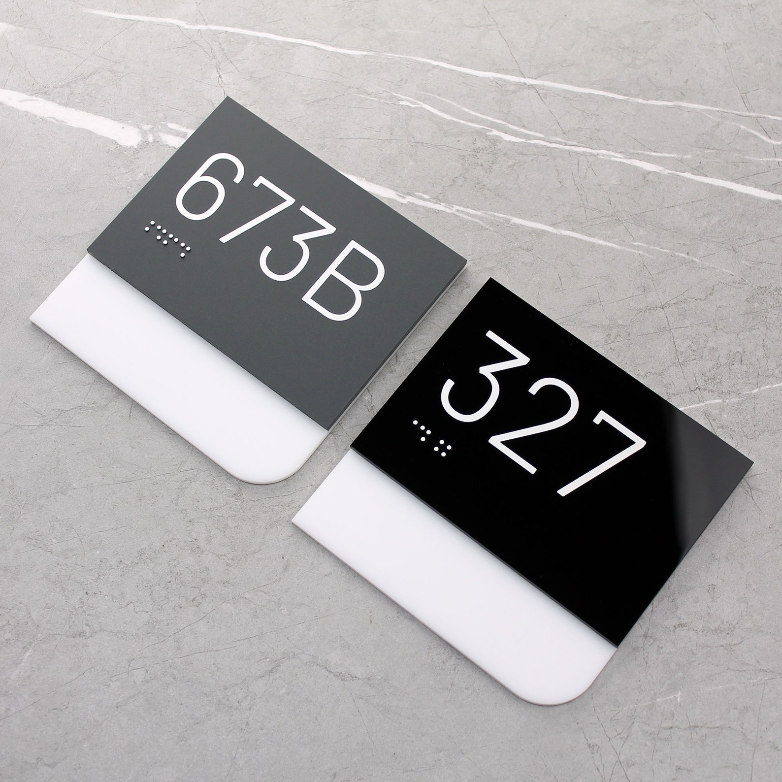 Office suite number series — in solid-surface with Braille giving a modern professional appearance. 